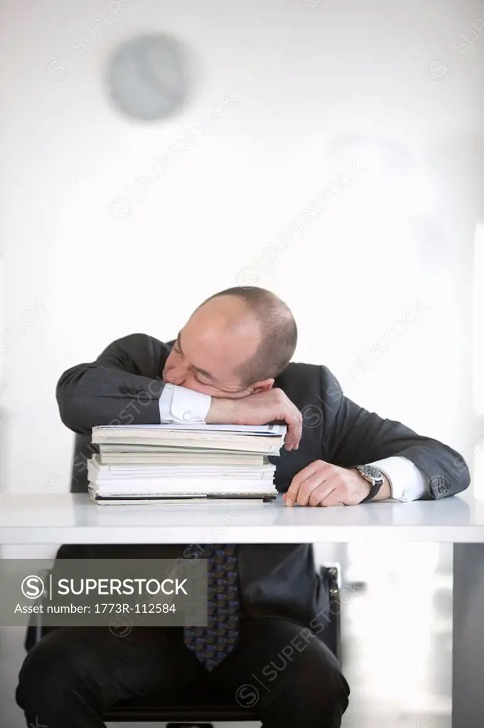 man is sleeping in office
