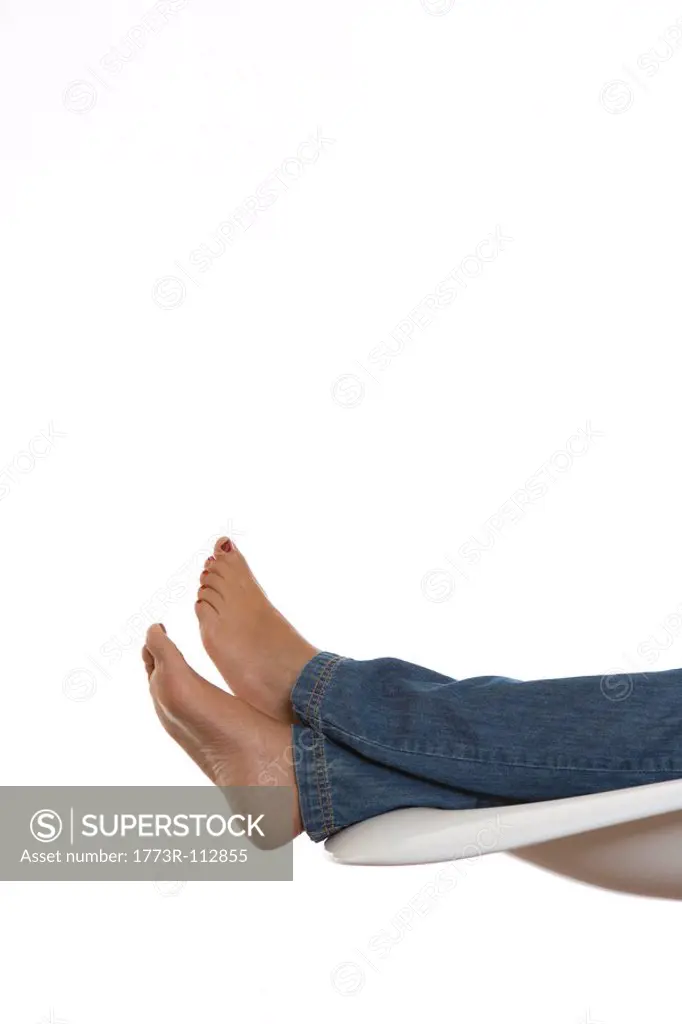 woman´s legs relaxed on a chair