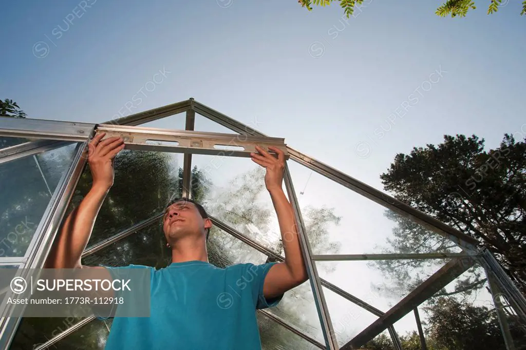 Man building greenhouse