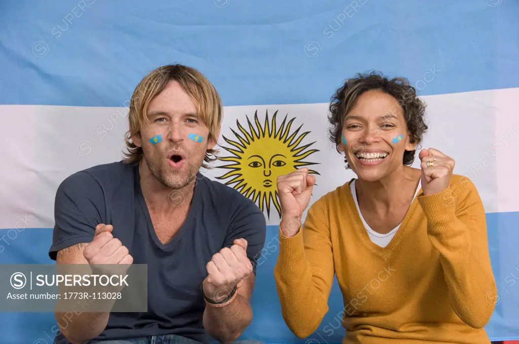 Couple smiling with Argentinian flag