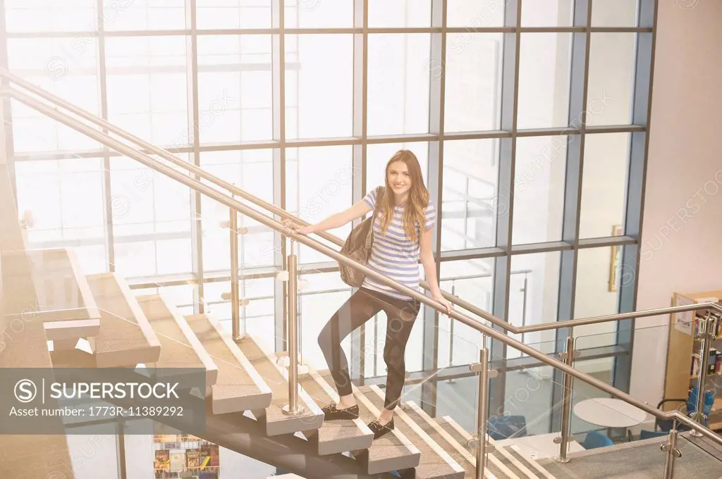 Young women standing on staircase