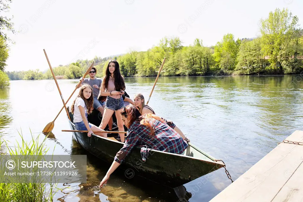Group of friends in a row boat