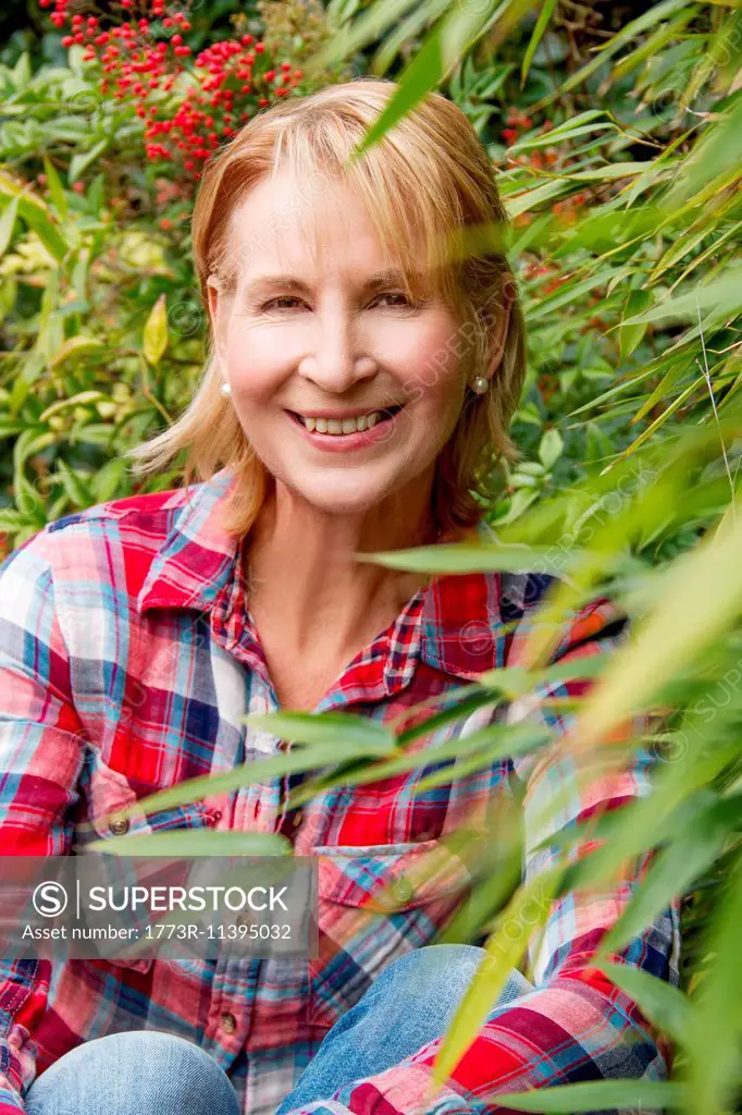 Portrait of mature woman in garden