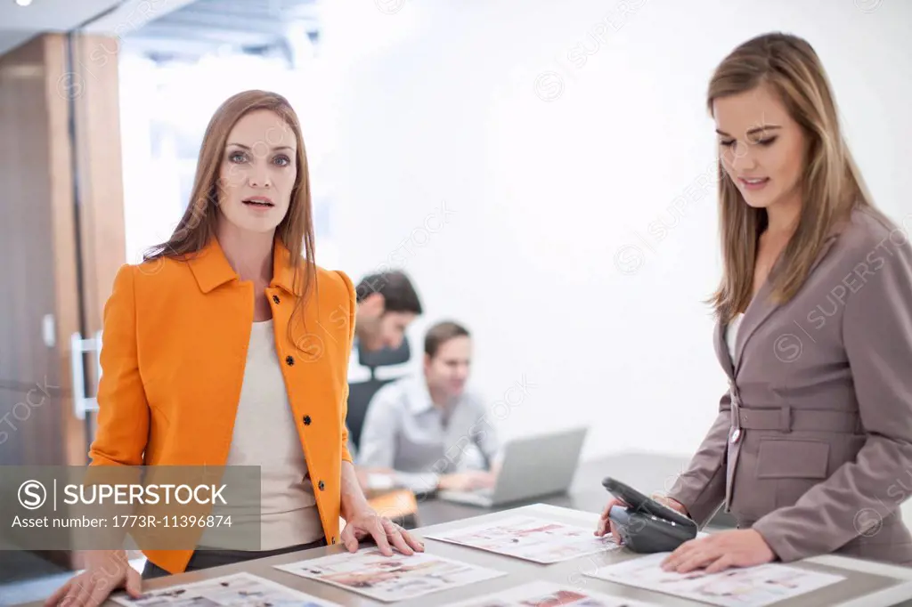 Female colleagues working in office