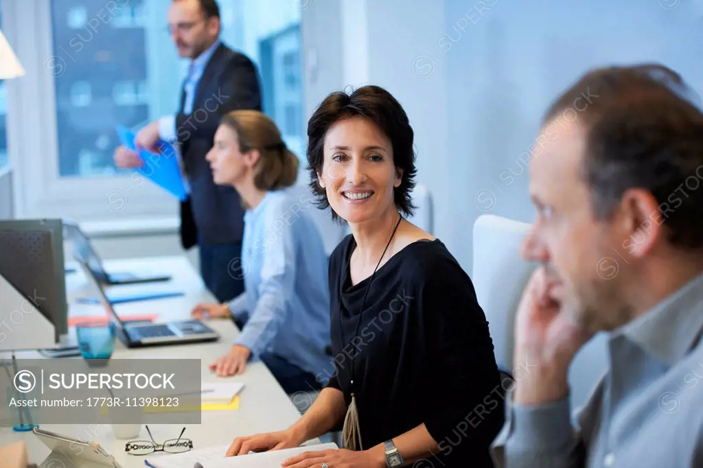 Businesspeople sitting at desk