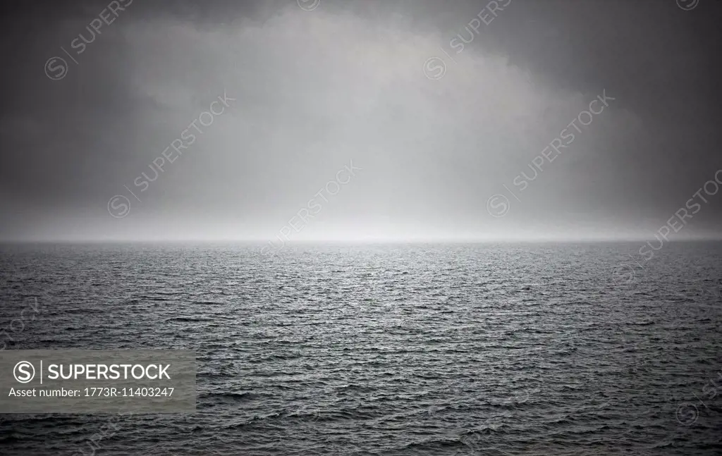Black and white seascape with stormy sky