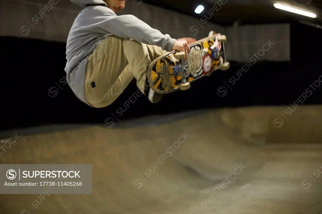 Young man doing skateboard trick