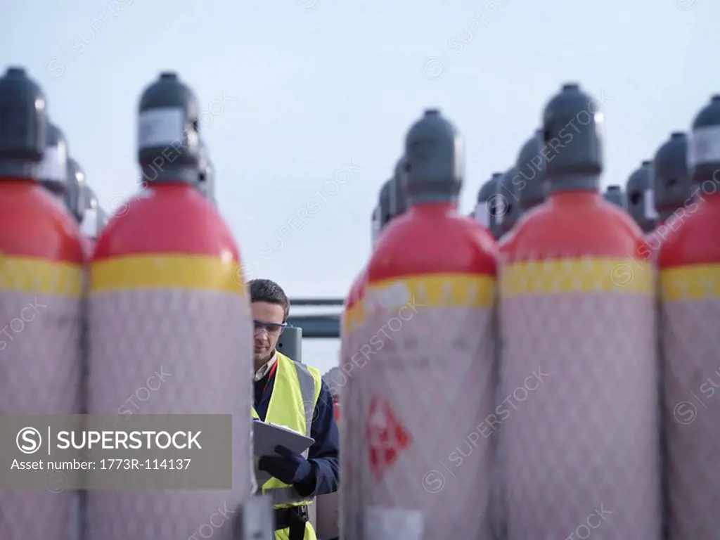 Port Worker With Gas Canisters