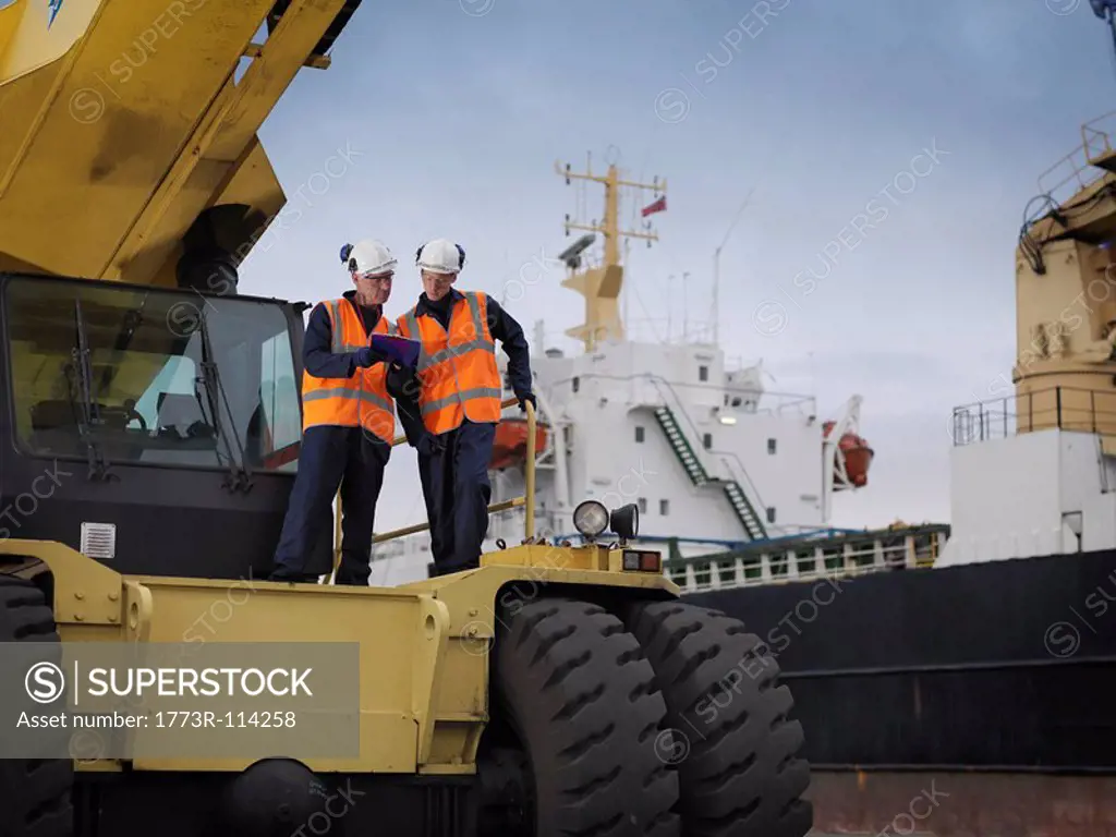 Port Workers With Heavy Machinery