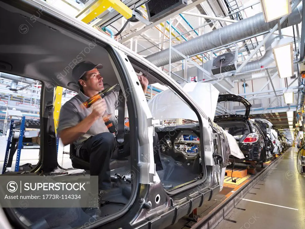 Car Plant Worker On Production Line