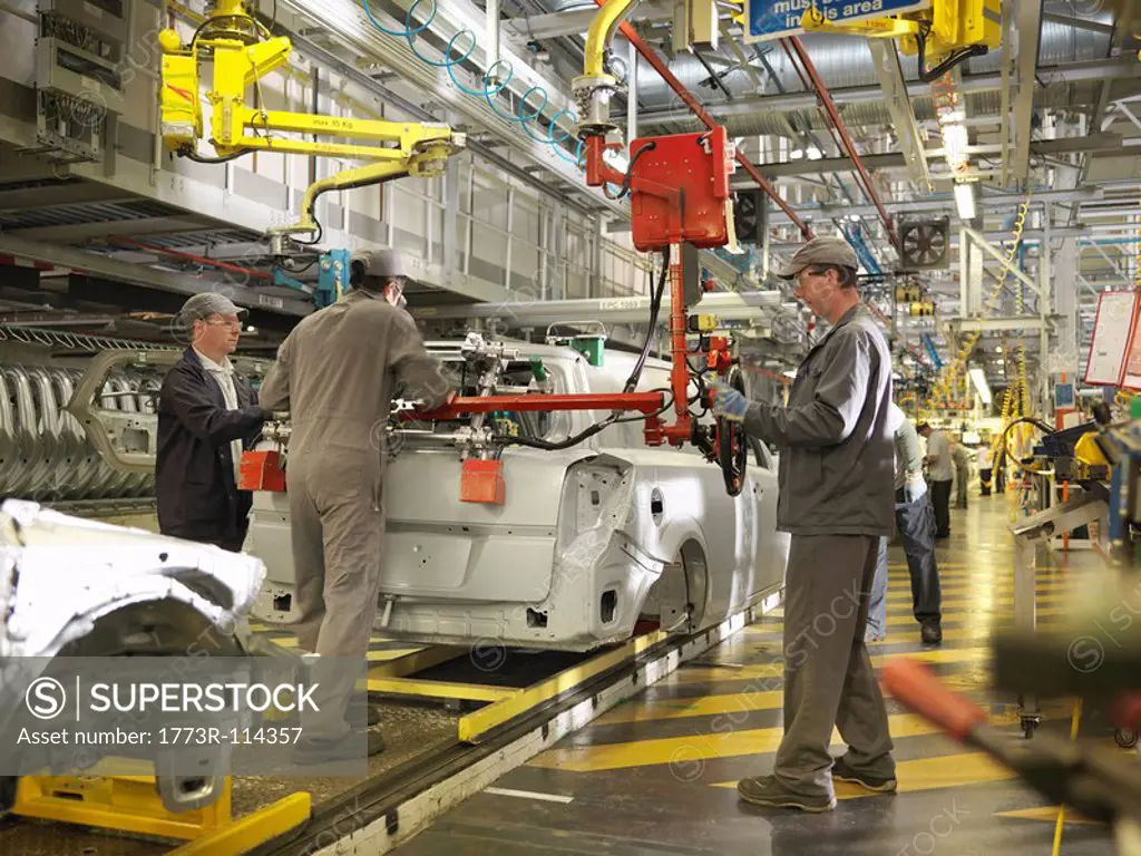 Car Plant Workers On Production Line