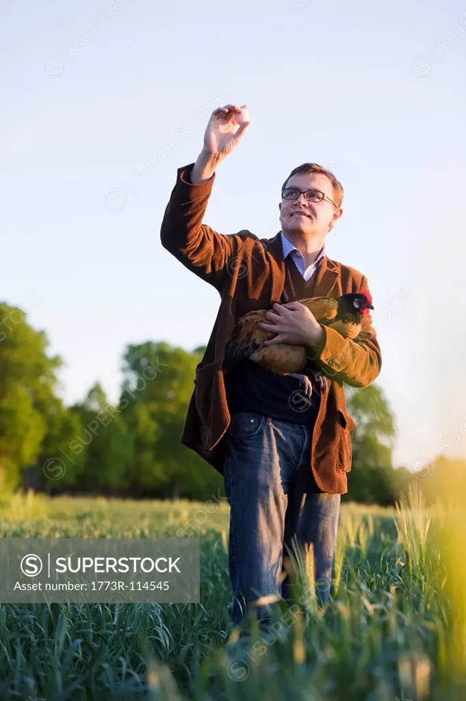 man holding chicken and egg