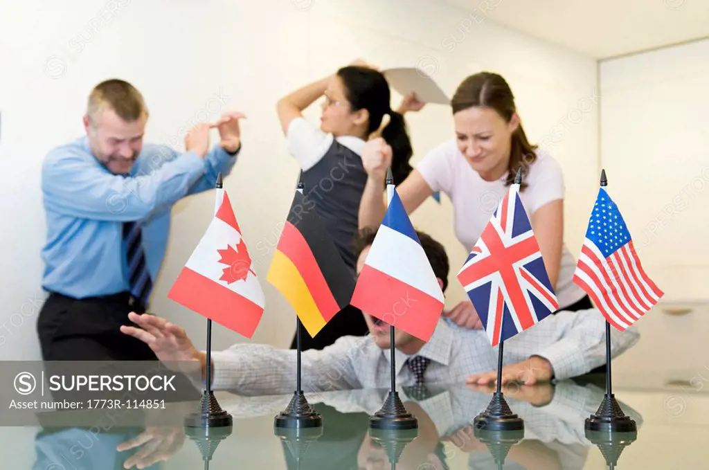 A business group fighting behind flags