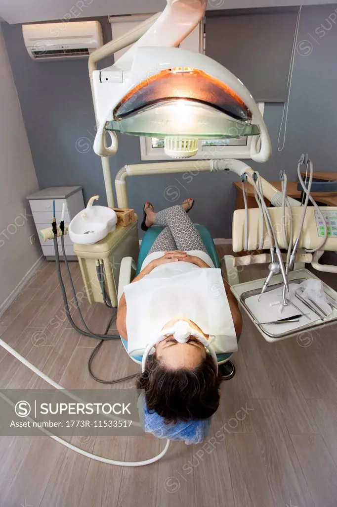 Female patient awaits the dentist in surgery