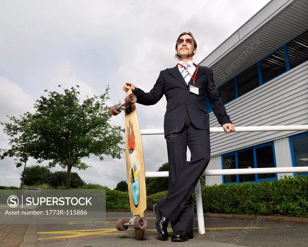 businessman with skateboard