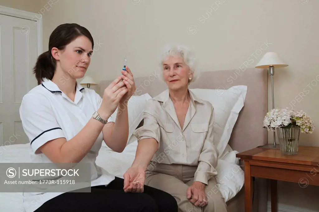 Nurse preparing injection for woman