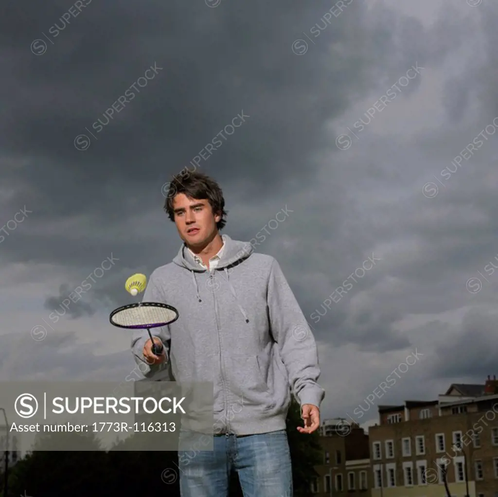 Young man with badminton racket