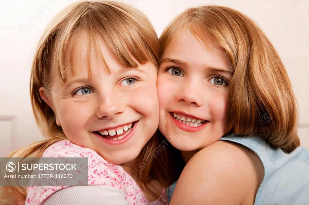 Portrait of two girls hugging