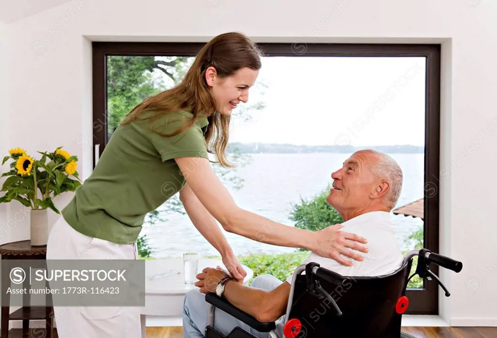 woman touching man in wheelchair