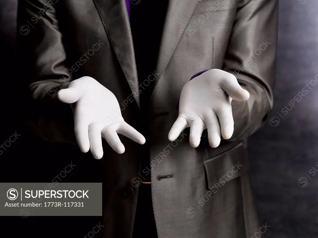 Business man wearing rubber gloves
