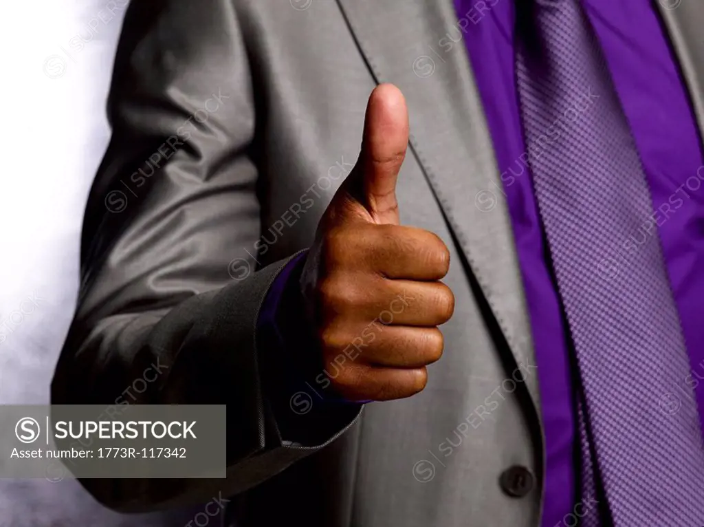 Business man giving thumbs up