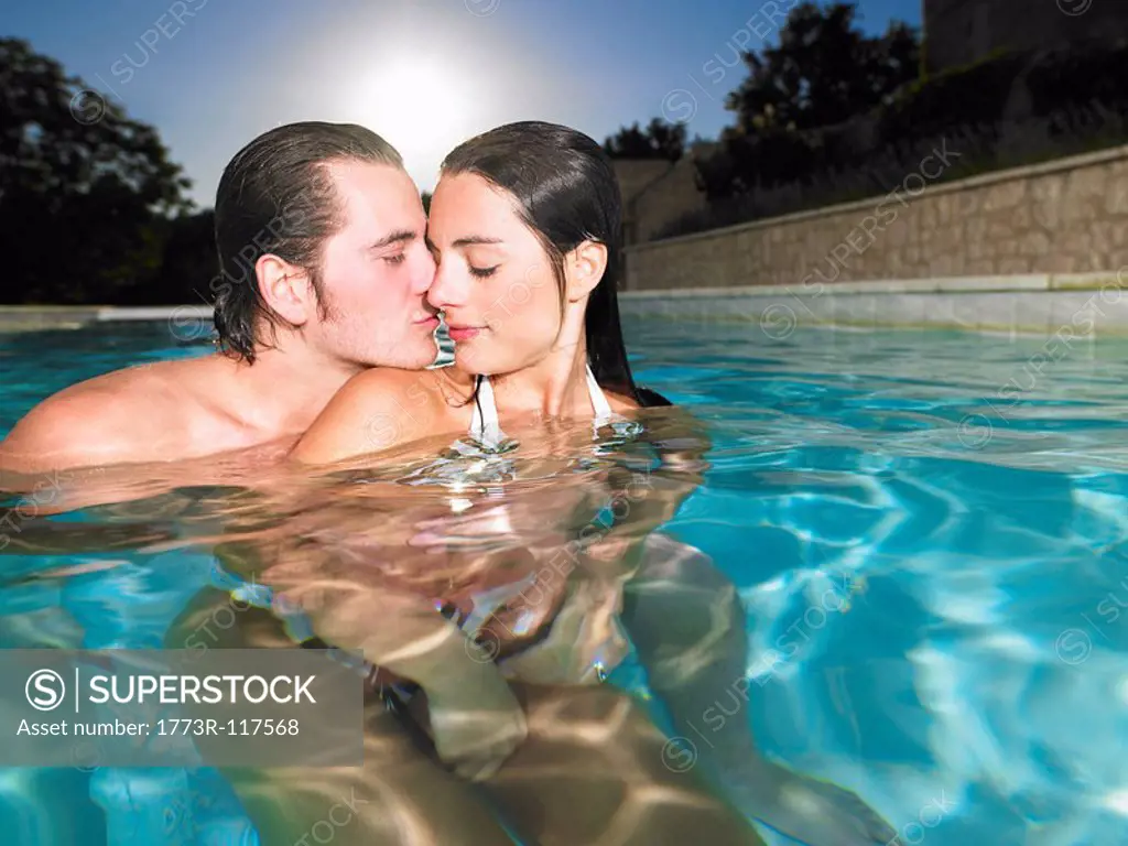 young couple in pool