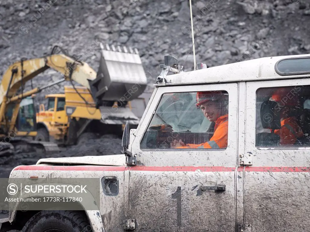 Coal Miners In Landrover In Mine