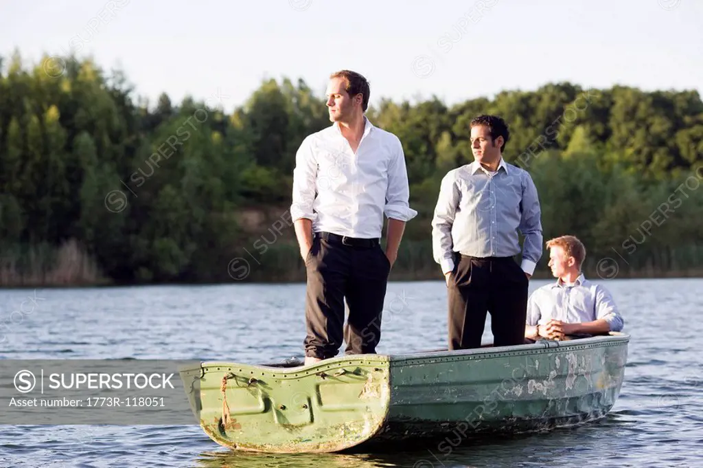 three businessmen in rowboat