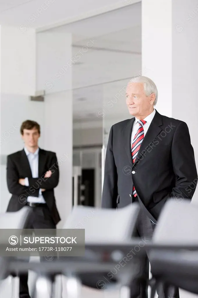two businessmen in meeting room