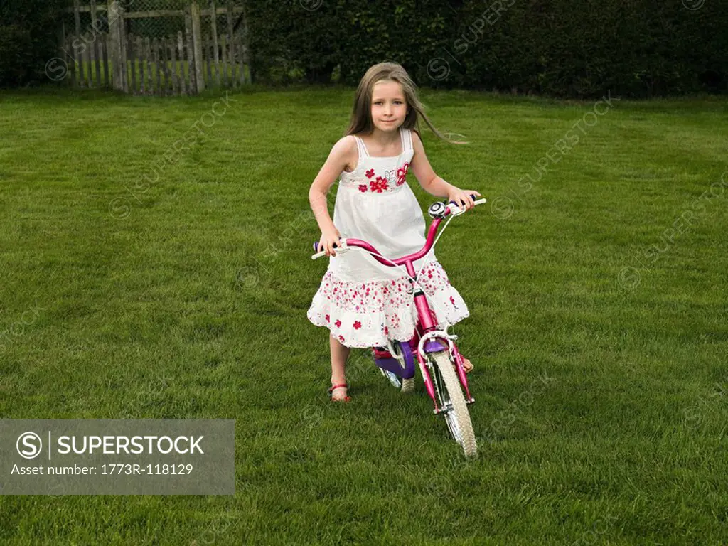 A young girl on a bike