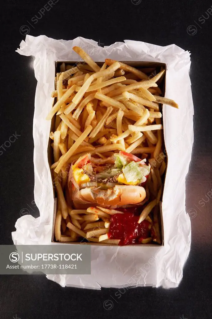 Fast food in take out box on paper bag