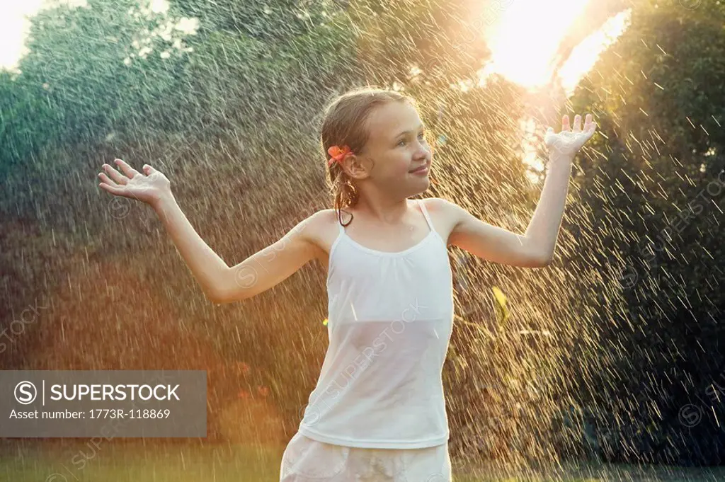 Girl standing in rain
