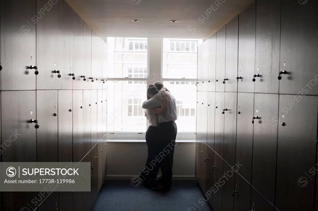 Couple office workers in locker room