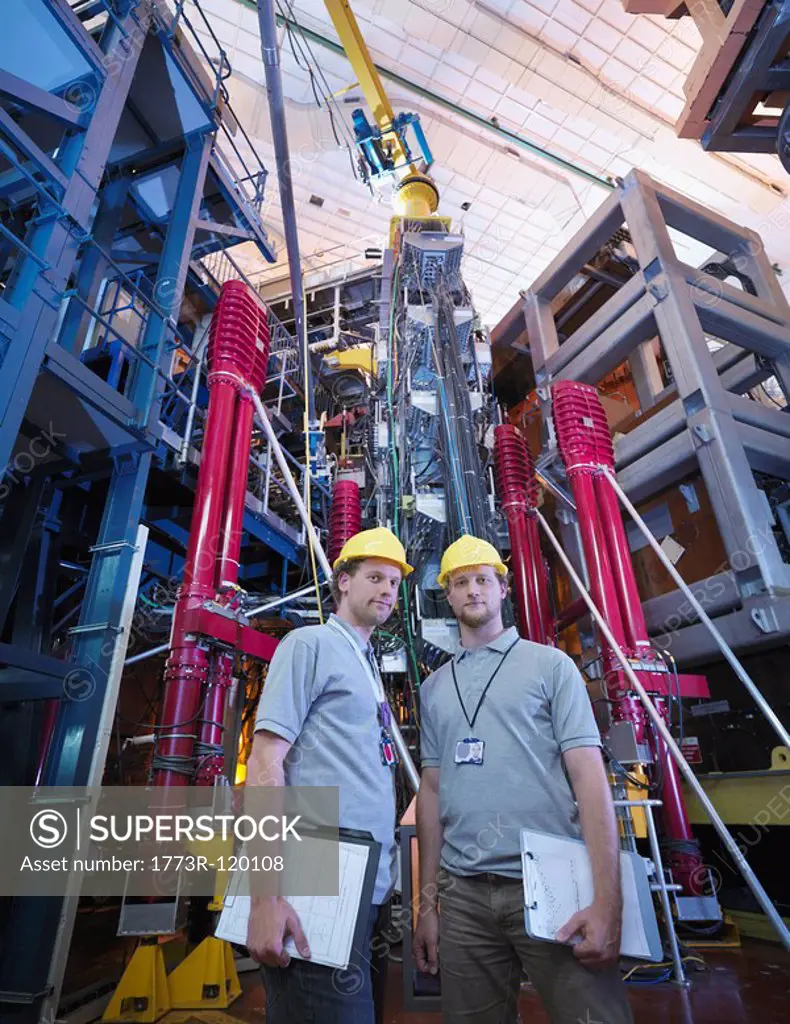 Scientists In Front Of Fusion Reactor