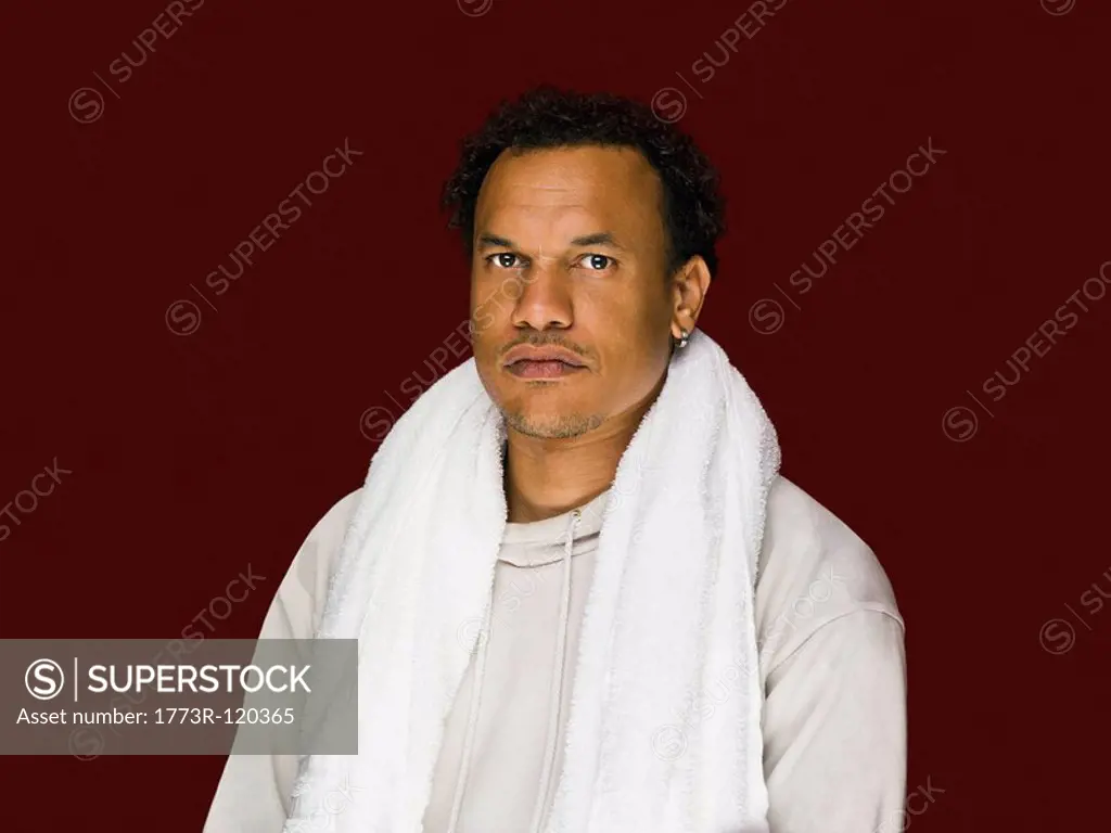 A portrait of a male with towel