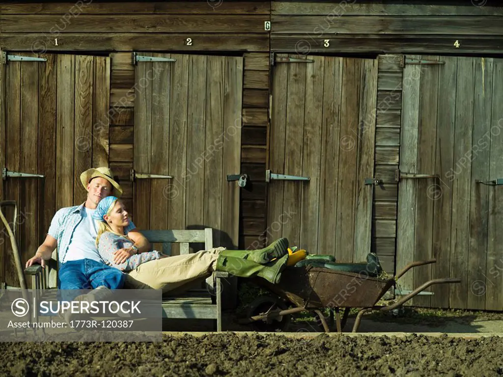 A couple relaxing in an allotment