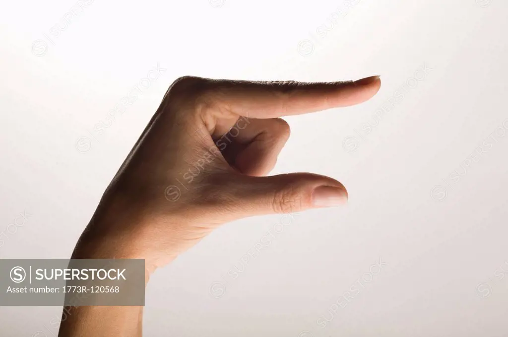 Hand measuring an object