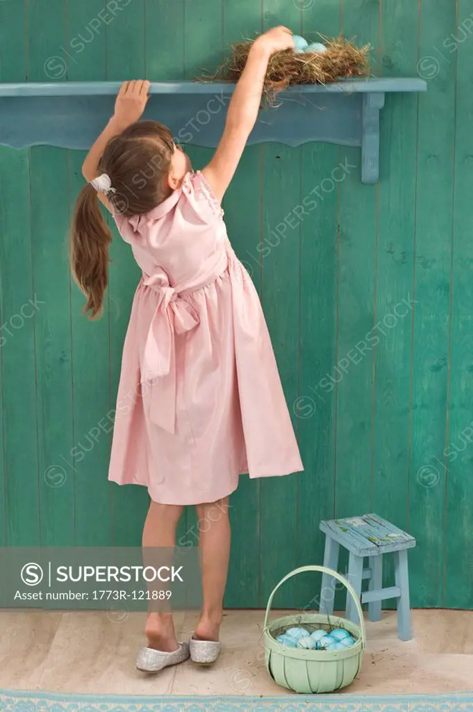 girl searching for Easter eggs