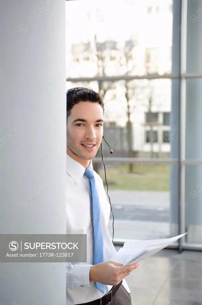 Young business man in office, headset