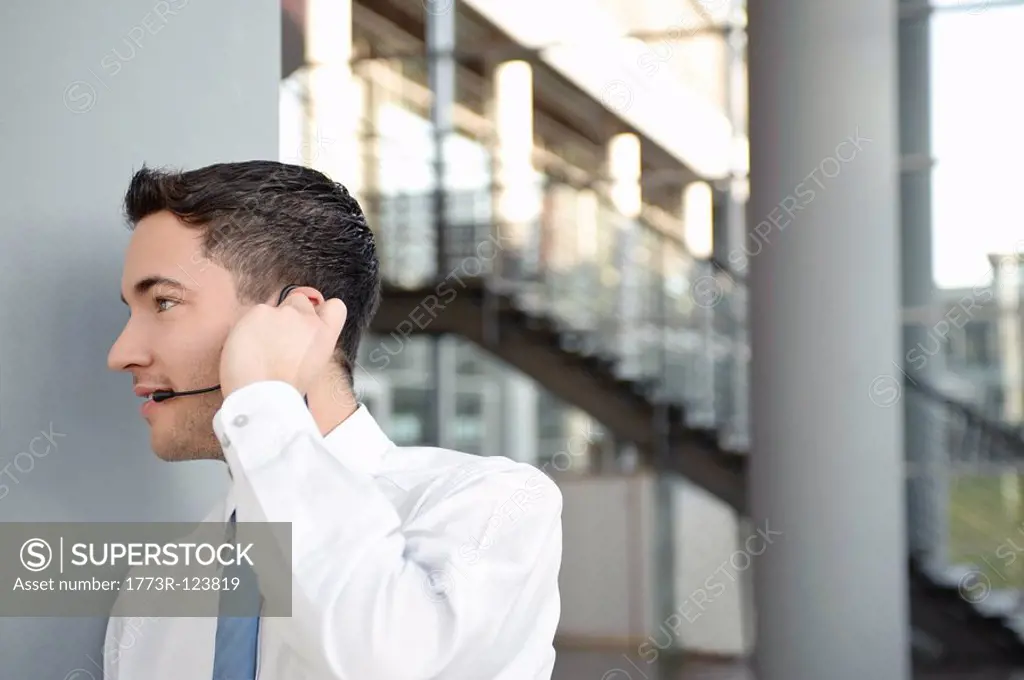 Young business man in office, headset