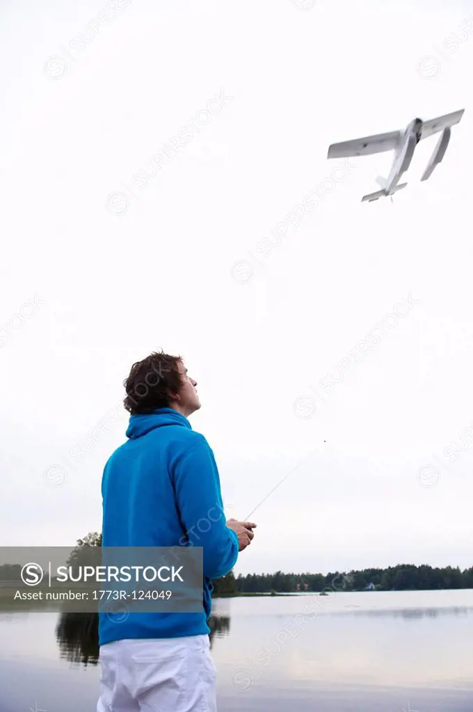 Man with a remote_controlled plane