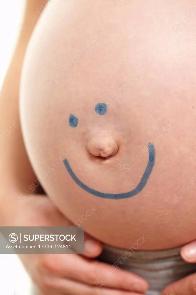 Pregnant belly with smiley face