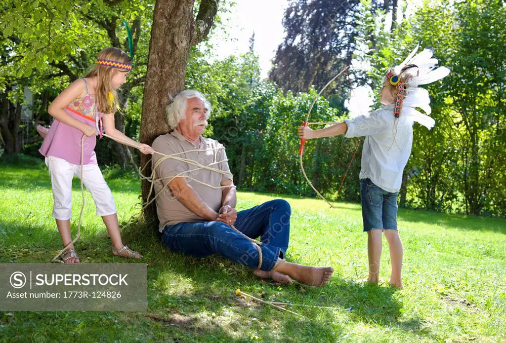 Grandchildren got their grandfather tied