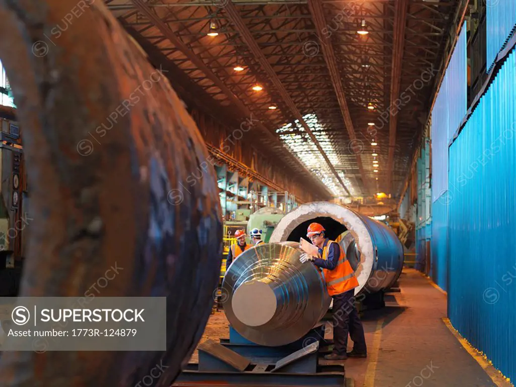 Engineer Inspecting Forged Steel Roller