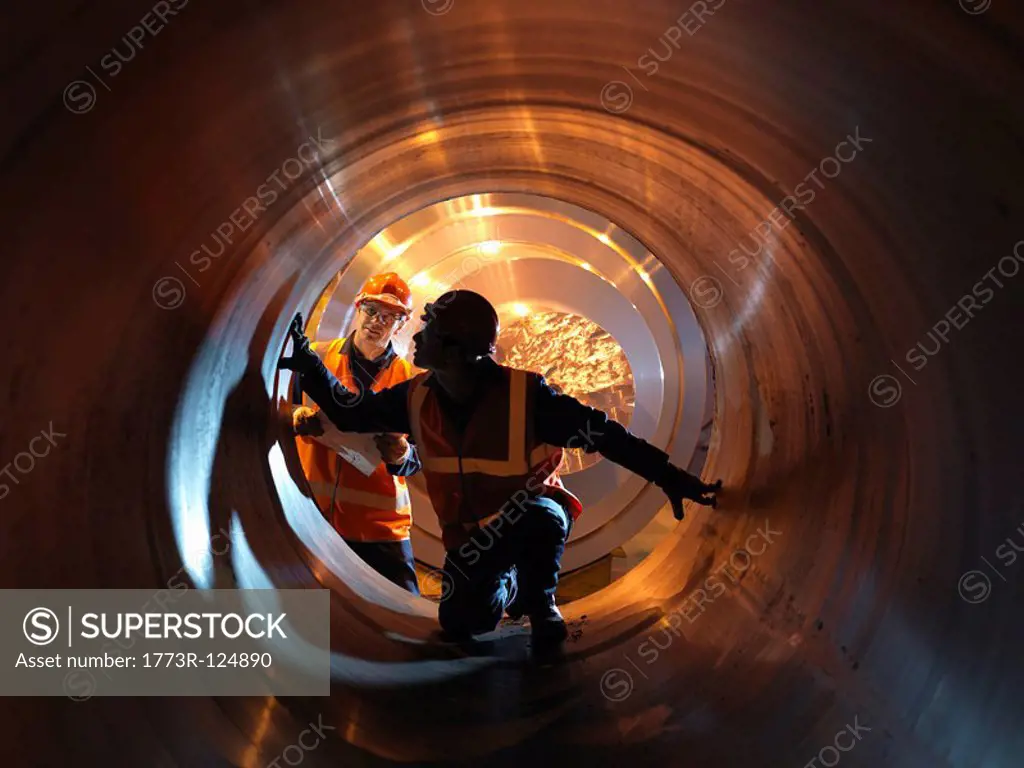 Engineers Inspecting Forged Steel