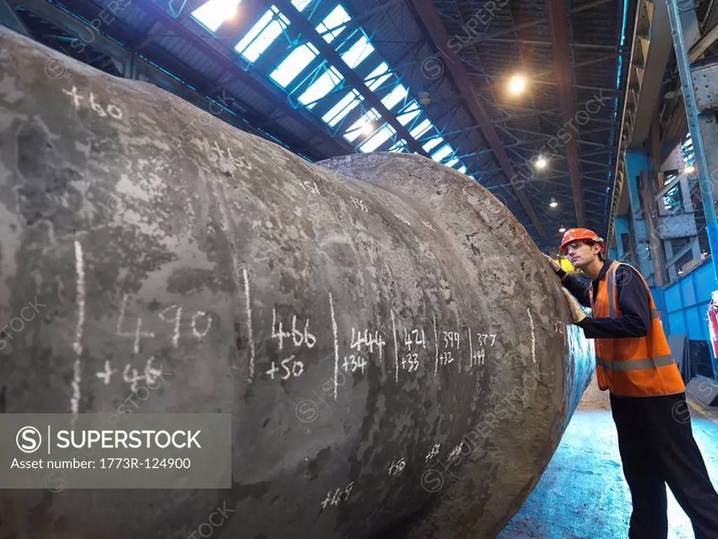 Engineer Inspecting Forged Steel