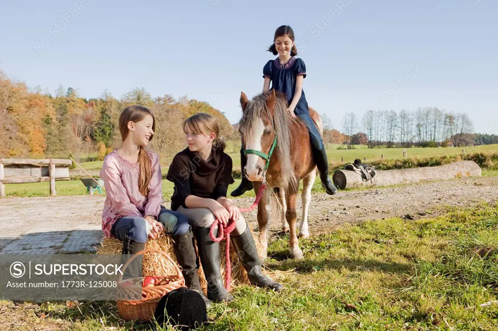 Girls at a stable
