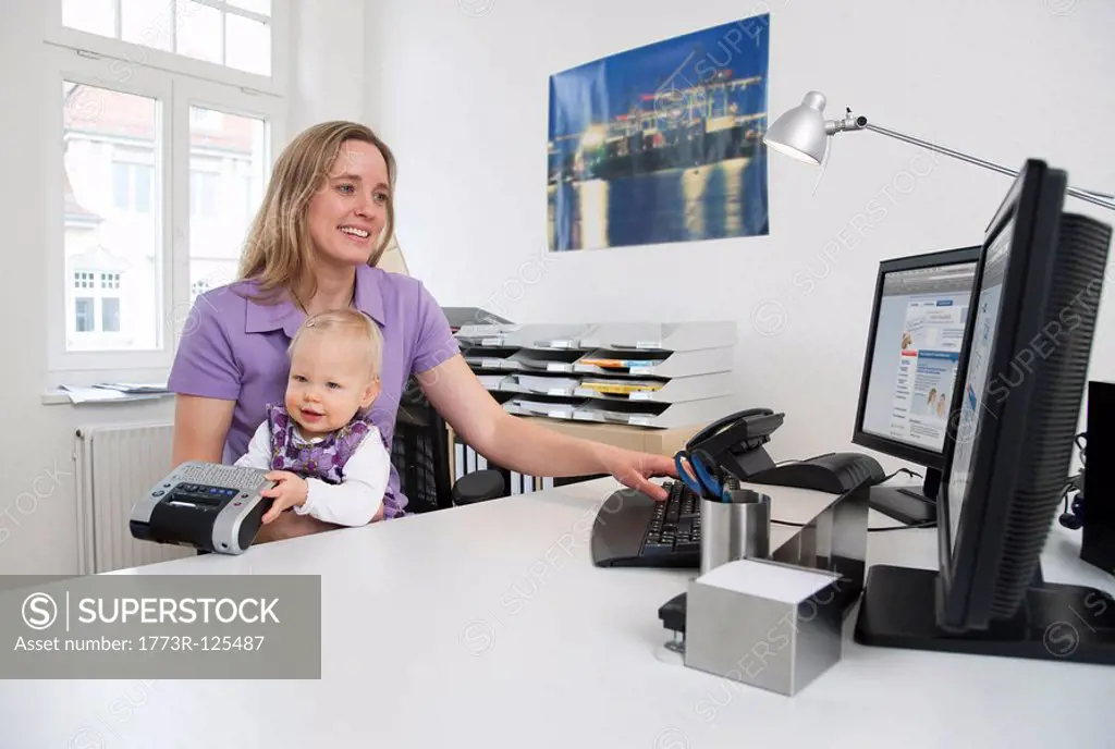 Businesswoman and baby in office