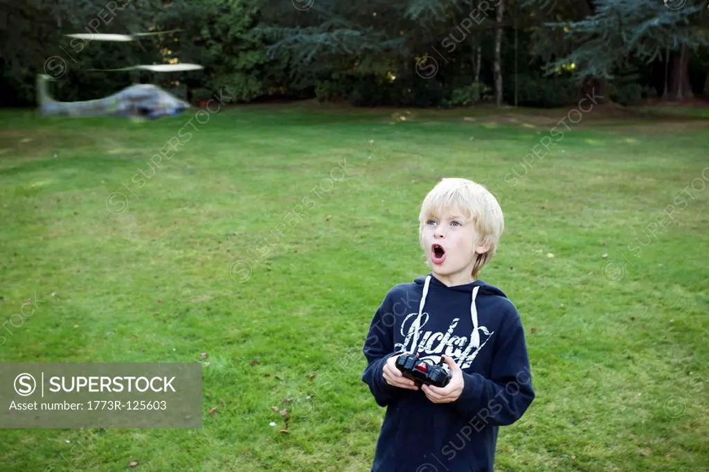 Boy with remote Helicopter