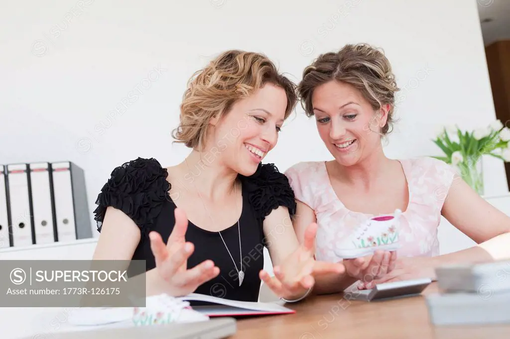 Two woman discussing business